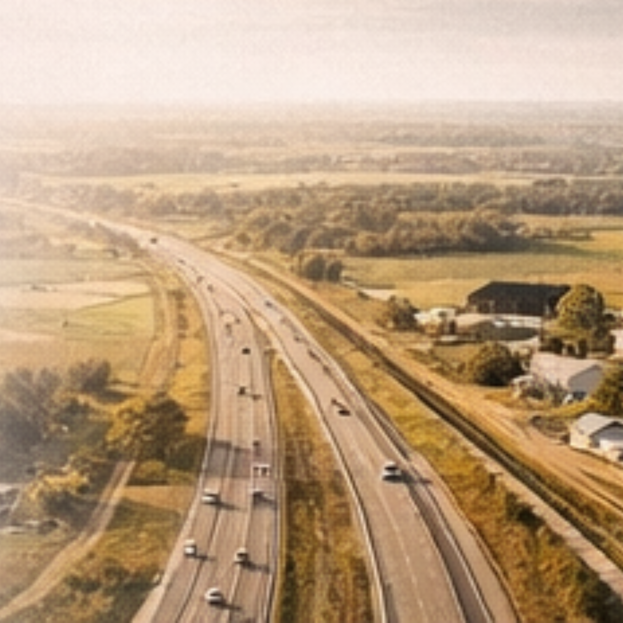 Aerial view of highway through rural farmland